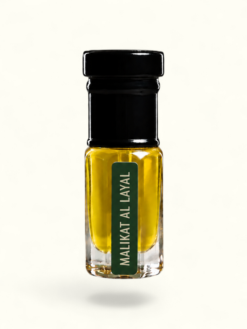 PERFUME BAY Malikat Al Layal attar in a small glass bottle with a black cap and green label featuring jasmine notes.