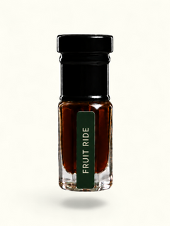 A small clear glass bottle with a black cap and a dark green label reading 'FRUIT RIDE' in white text, filled with a dark amber-brown liquid, centered on a plain white background.