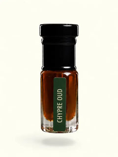 PERFUME BAY Chypre Oud attar in a small glass bottle with a black cap and green label against a cream background.
