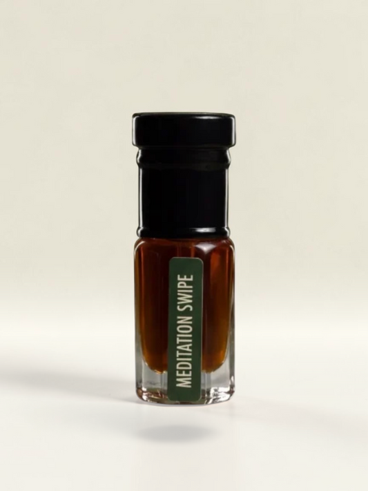 PERFUME BAY Meditation Swipe Next Chapter attar in a small glass bottle with a black cap and green label