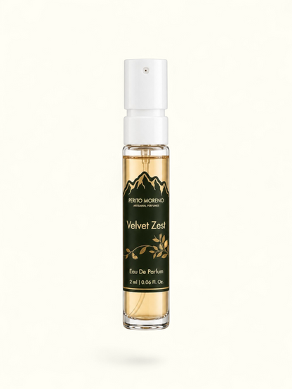 PERFUME BAY Velvet Zest 2ml eau de parfum sample vial with a dark green label featuring mountain and citrus graphics.