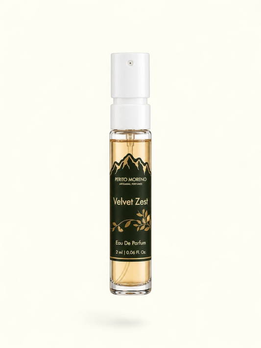 PERFUME BAY Velvet Zest 2ml eau de parfum sample vial with a dark green label featuring mountain and citrus graphics.
